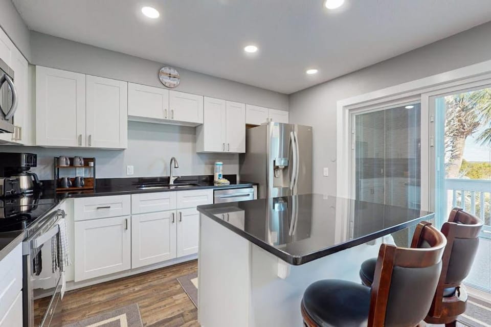 Gorgeous coastal townhome patio balcony and community HEATED pool House in Pensacola Beach