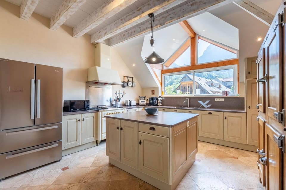 Kitchen or kitchenette, dishwasher, oven, stove