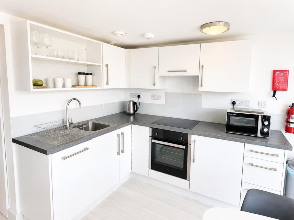 Kitchen or kitchenette, oven, stove