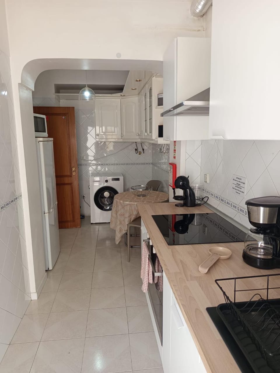 Kitchen or kitchenette, stove, washing machine