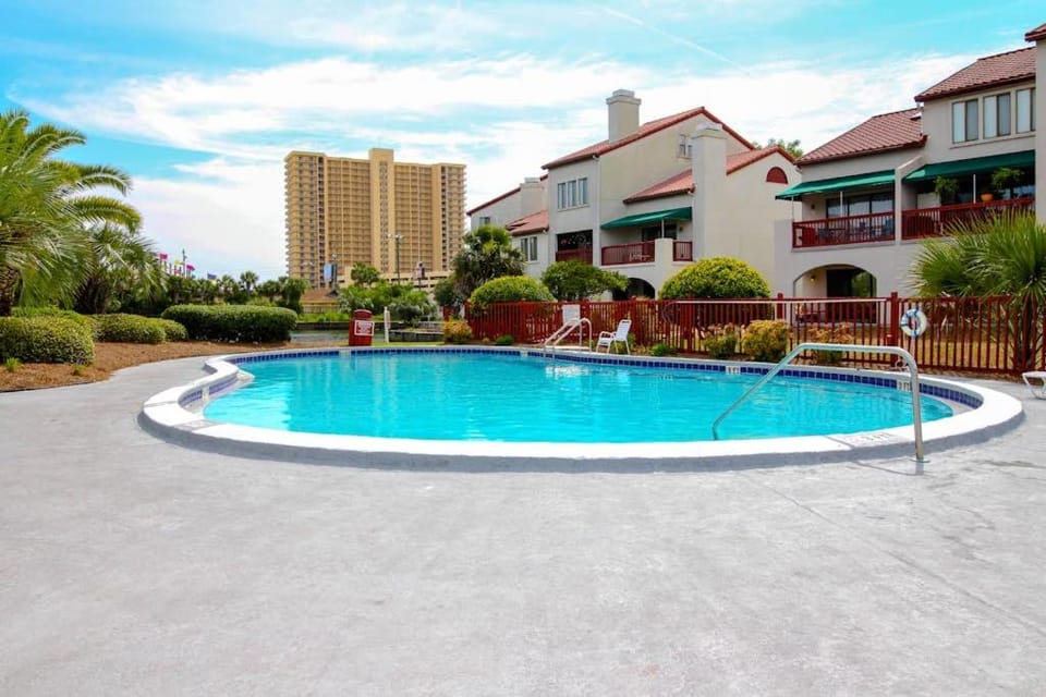 Resort condo near beach with private balcony WiFi pool tennis & dock Apartment in Lower Grand Lagoon