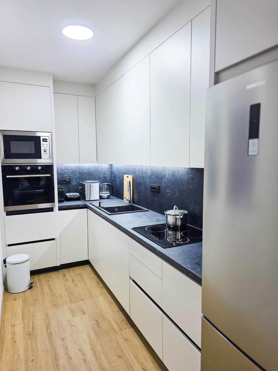 Kitchen or kitchenette, dishwasher, oven, stove