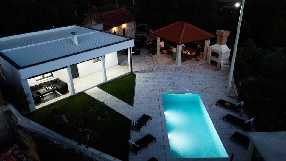 Property building, Patio, Night, Natural landscape, Pool view, Swimming pool, sunbed