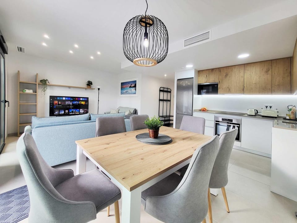 TV and multimedia, Kitchen or kitchenette, Living room, Seating area, Dining area, oven, stove, air conditioner