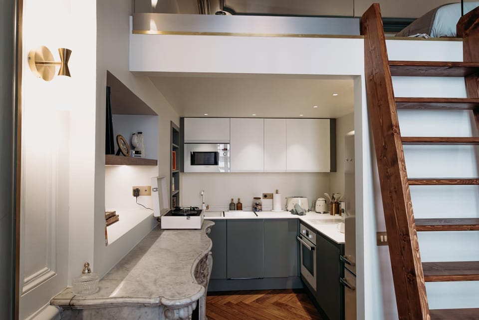 Kitchen or kitchenette, dishwasher, oven, stove