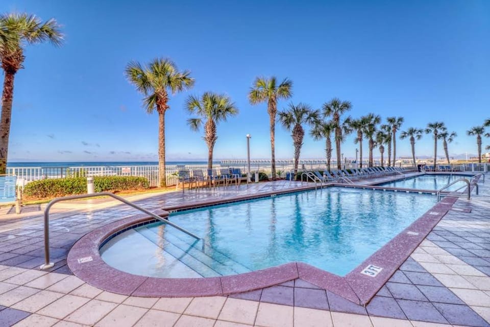 Tropical-themed condo with bi-level pool fitness center & beach access House in Panama City Beach