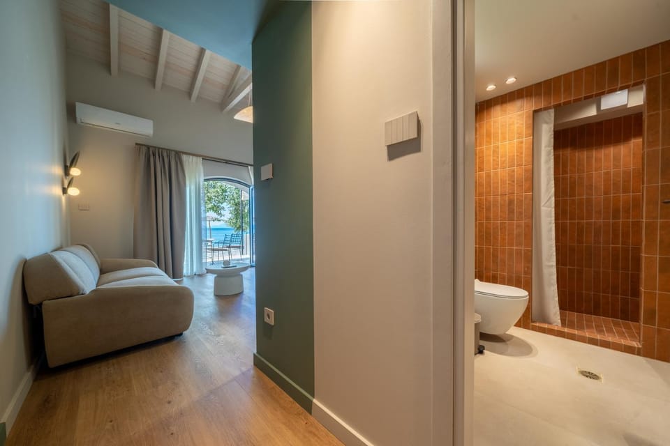 Toilet, Bed, Bathroom, Living room, Photo of the whole room, Seating area, Bedroom