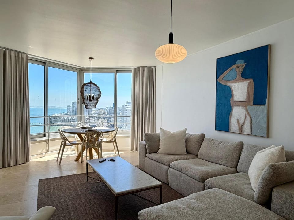 View (from property/room), Living room, Seating area, Dining area, Sea view