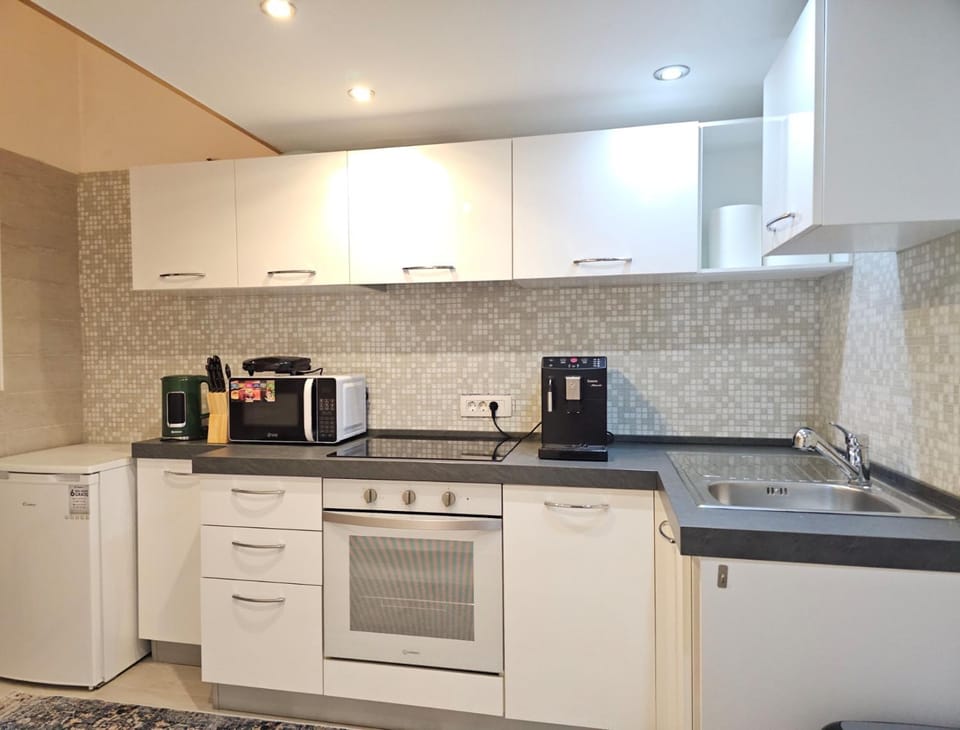 Kitchen or kitchenette, oven, toaster