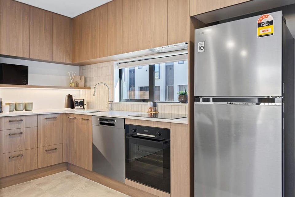 Kitchen or kitchenette, dishwasher, oven, stove, toaster