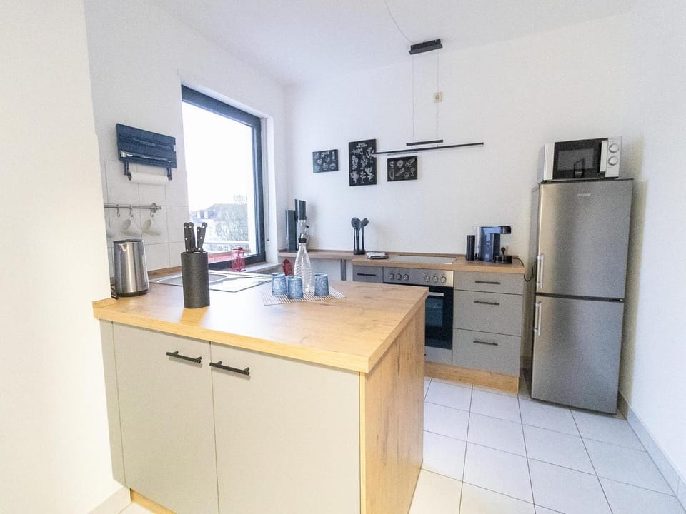 Kitchen or kitchenette, dishwasher, oven, stove