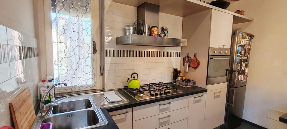 Kitchen or kitchenette, dishwasher, oven, stove