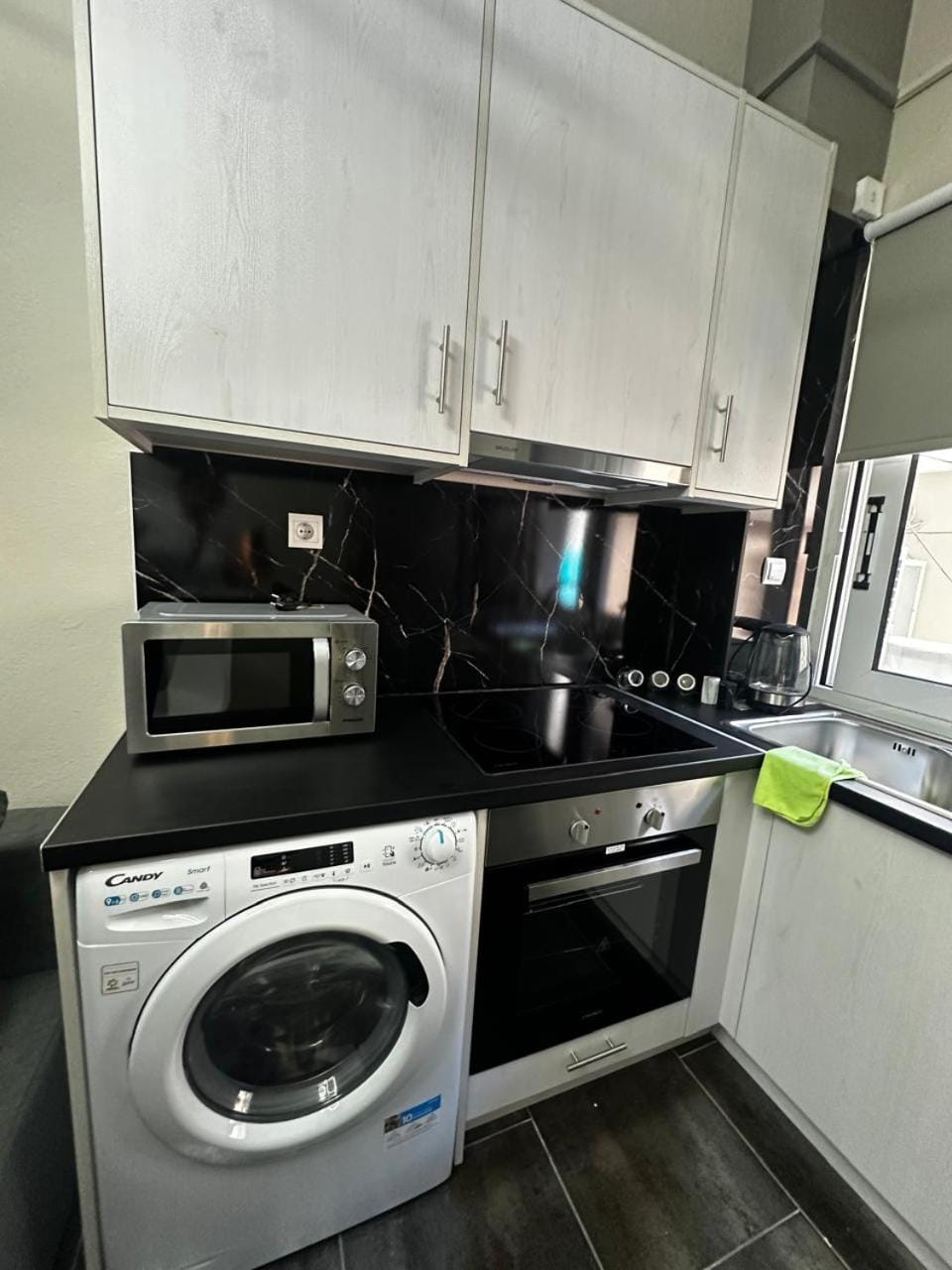 Kitchen or kitchenette, oven, stove, washing machine