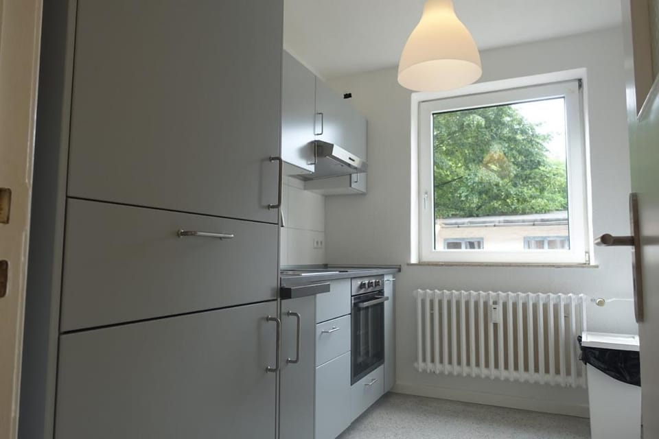 Kitchen or kitchenette, dishwasher, oven, stove