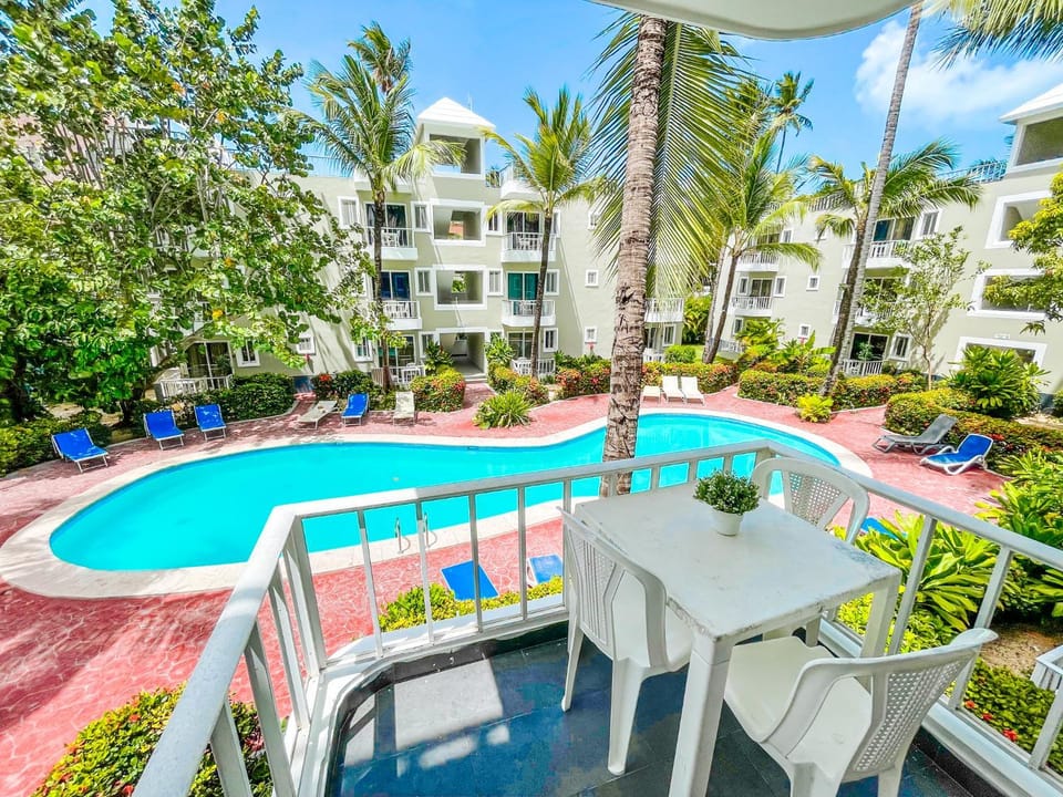 Property building, Patio, Day, Garden, View (from property/room), Balcony/Terrace, Garden view, Pool view, Swimming pool, sunbed