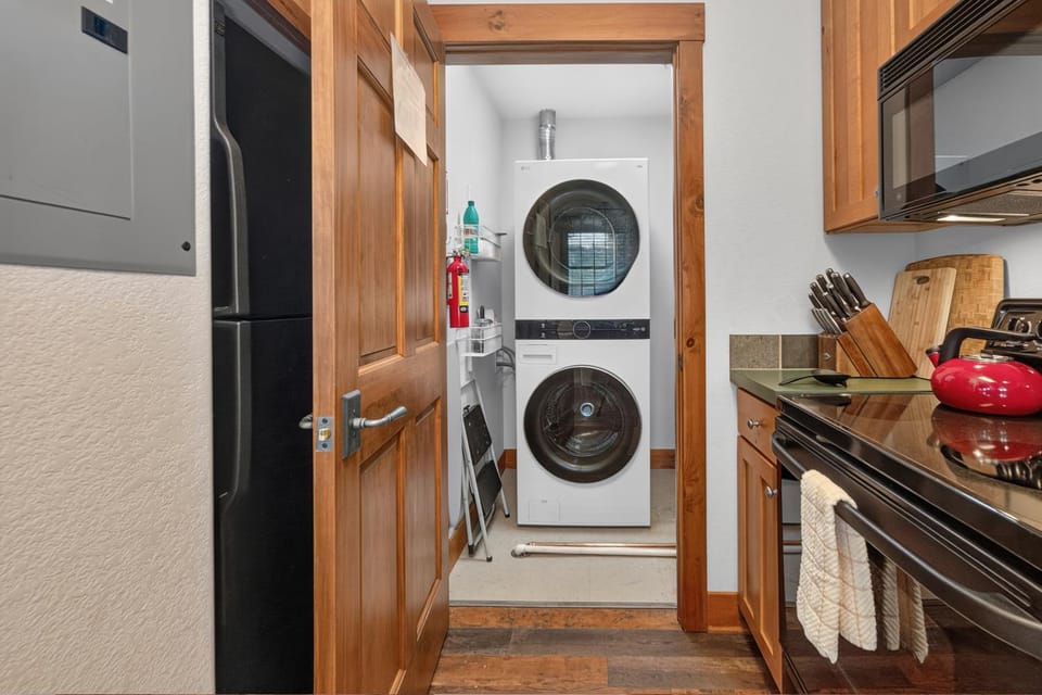 Kitchen or kitchenette, furniture, stove, washing machine, dryer