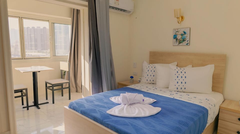 Bed, Photo of the whole room, Bedroom, towels, air conditioner
