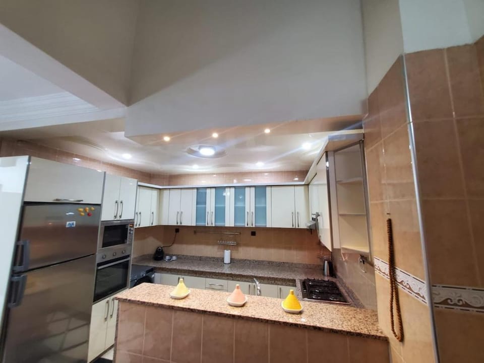 Kitchen or kitchenette, microwave, oven, washing machine