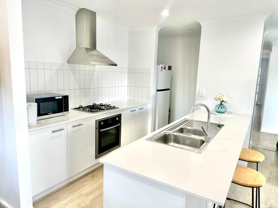 Kitchen or kitchenette, dishwasher, oven, stove, toaster