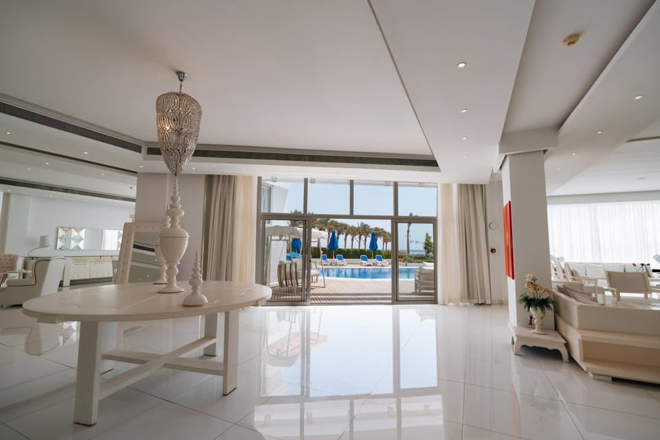 Living room, Seating area, Pool view