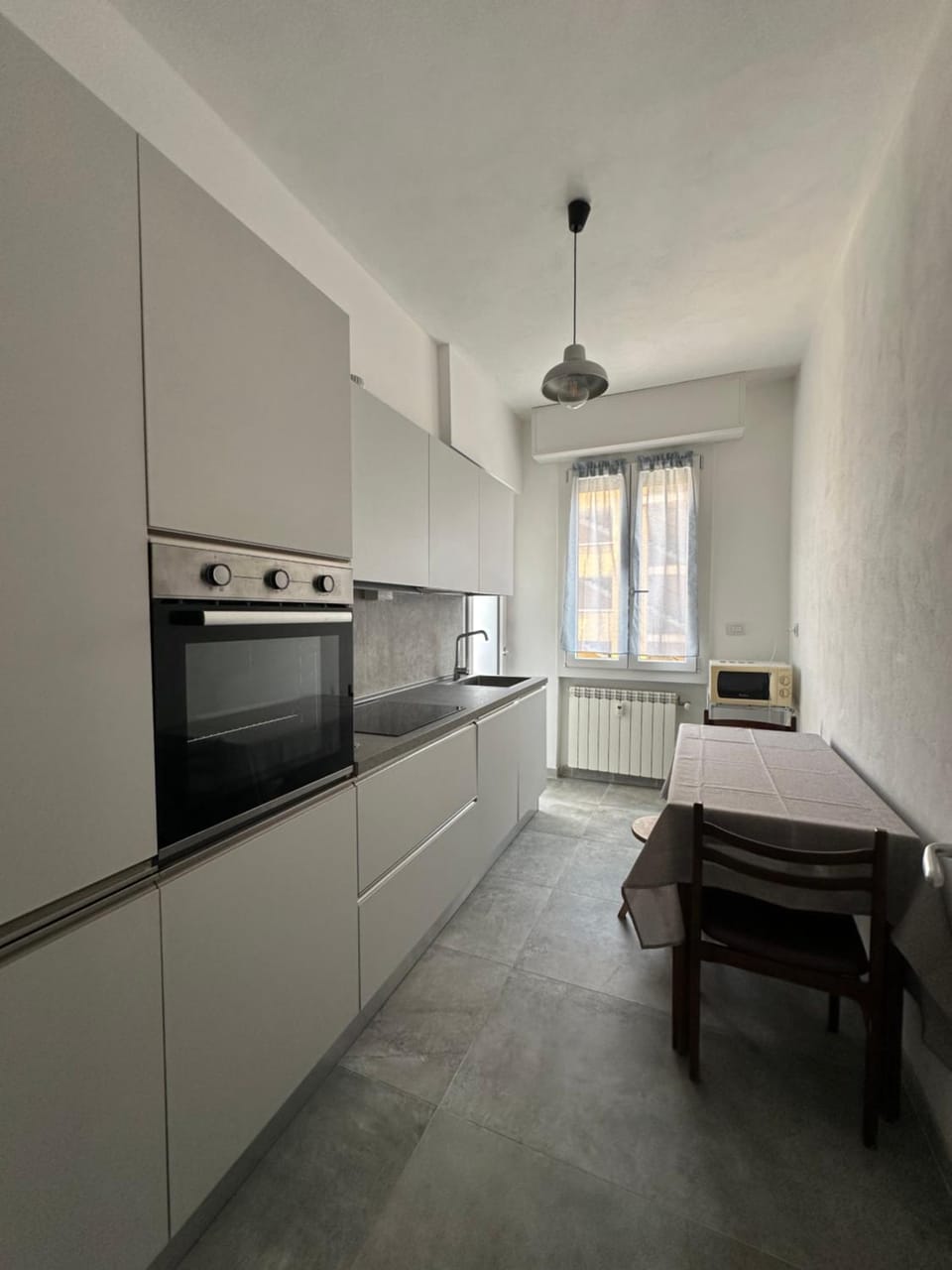 Kitchen or kitchenette, dishwasher, oven, stove