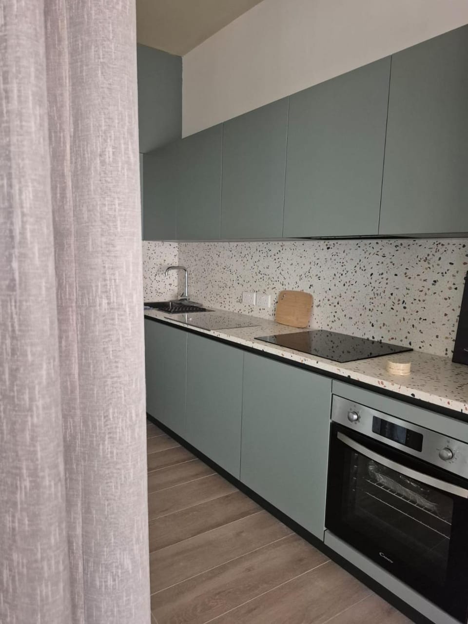 Kitchen or kitchenette, dishwasher, oven, stove