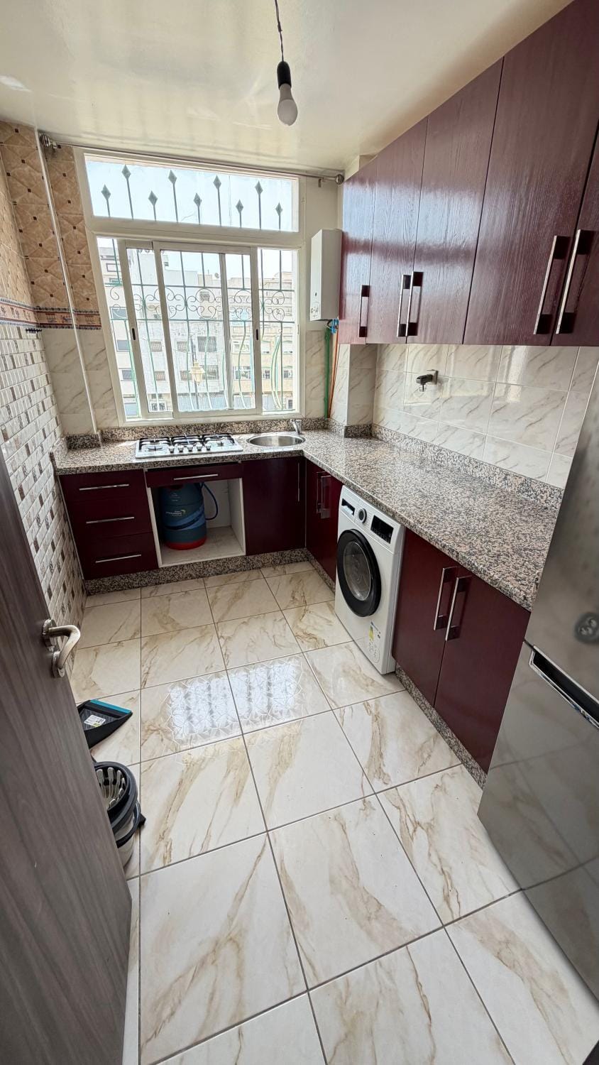 Kitchen or kitchenette, stove, washing machine