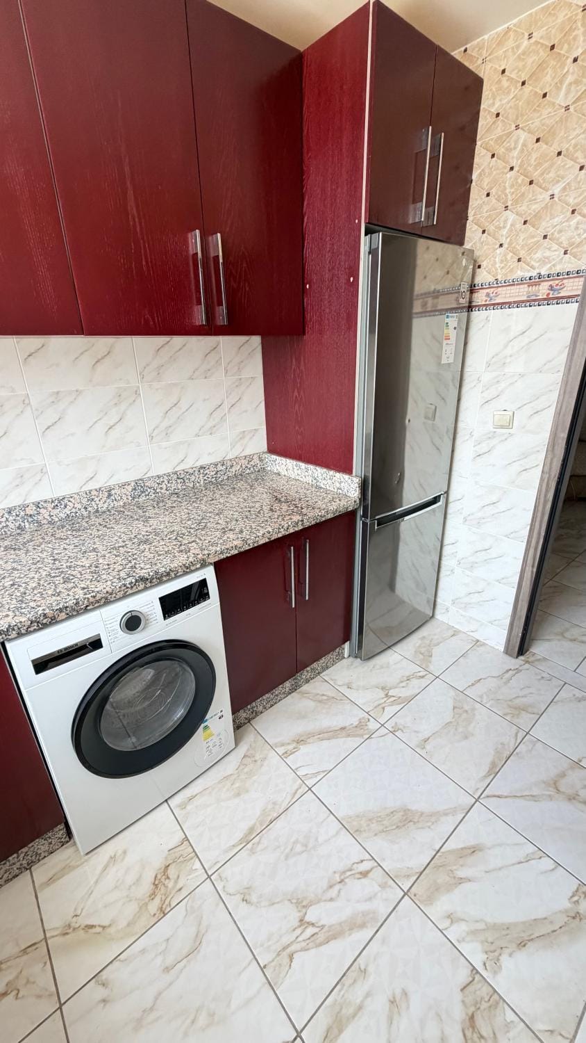 Kitchen or kitchenette, washing machine