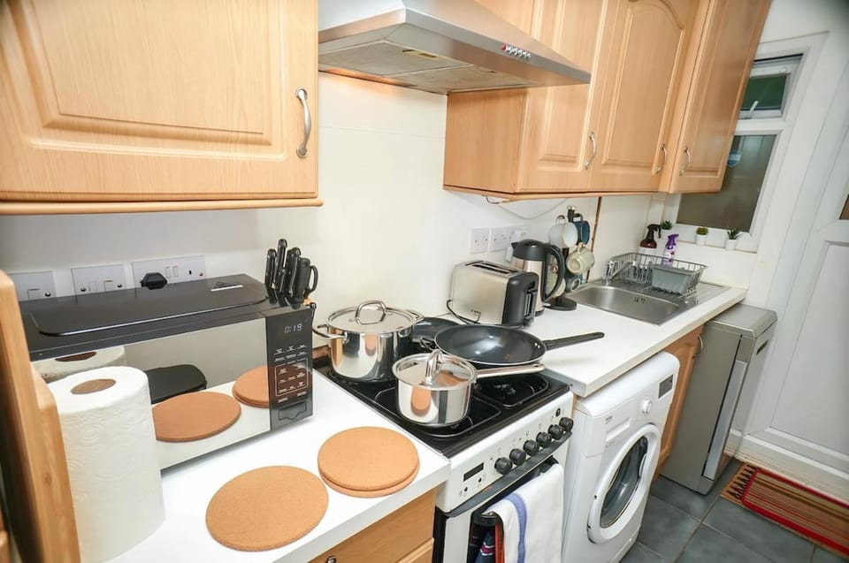 Kitchen or kitchenette, dishwasher, stove, toaster