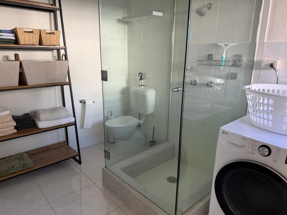 Shower, Toilet, Bathroom, towels, washing machine, dryer