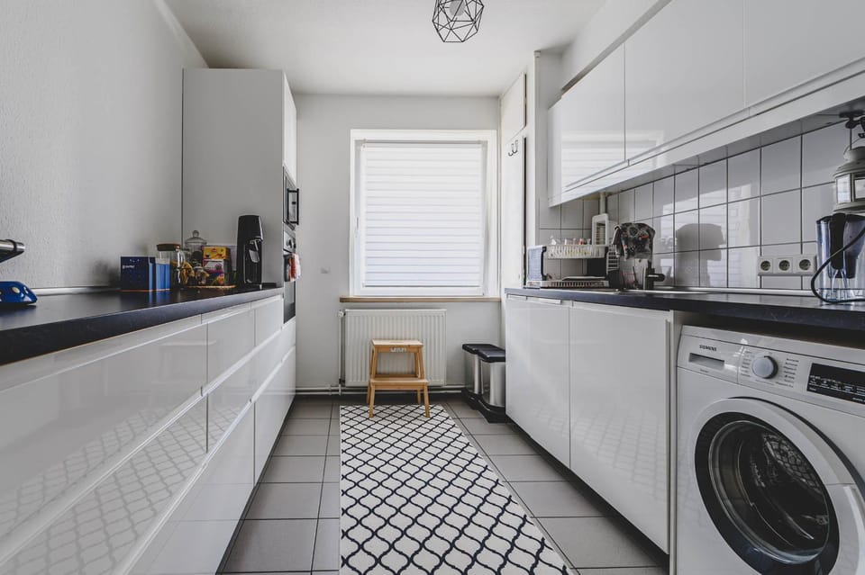 Kitchen or kitchenette, dishwasher, oven, stove, toaster, washing machine