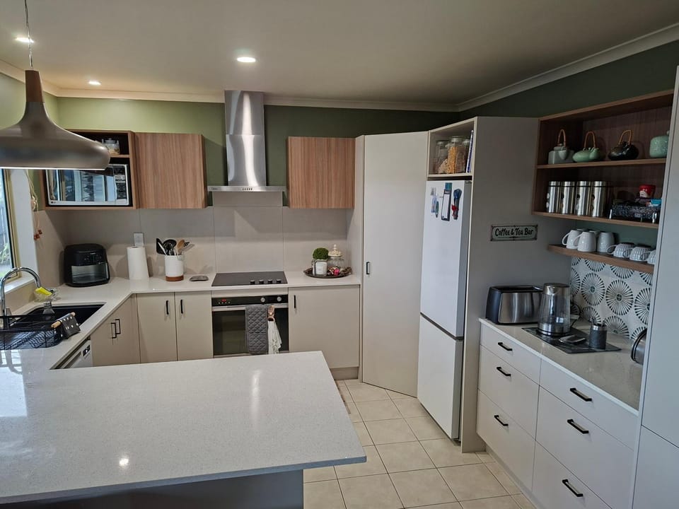 Kitchen or kitchenette, dishwasher, oven, stove