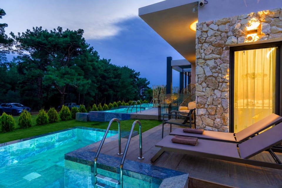 Property building, Patio, Natural landscape, Pool view, Swimming pool, sunbed