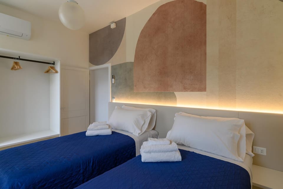 Bed, Bedroom, towels, wardrobe, air conditioner