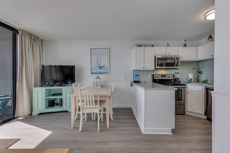 Dining area, dishwasher, oven, stove, toaster, kitchen