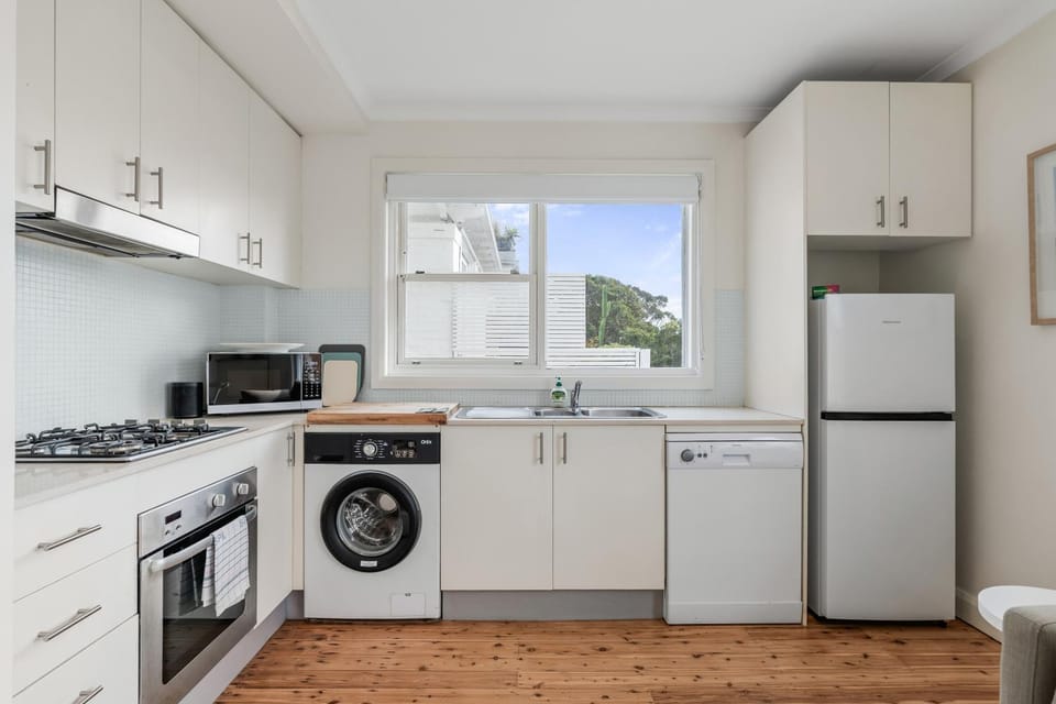 Kitchen or kitchenette, dishwasher, oven, stove, washing machine