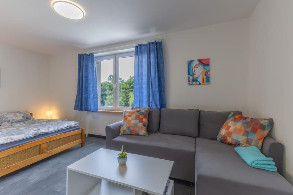 Bed, Living room, Seating area, Bedroom