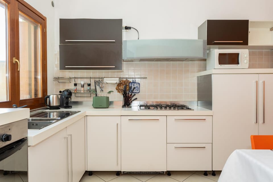 Kitchen or kitchenette, dishwasher, oven, stove, toaster