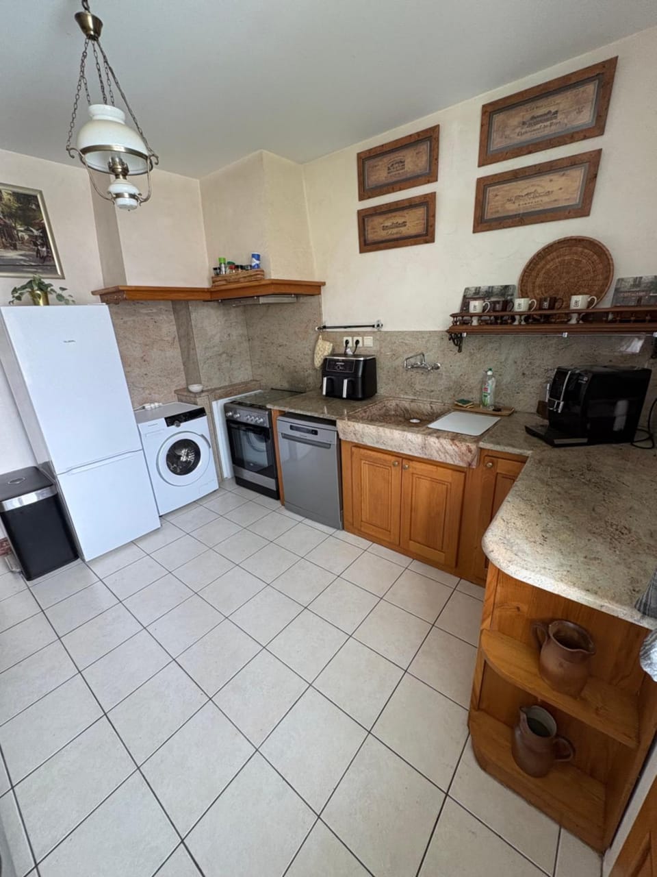 Kitchen or kitchenette, dishwasher, oven, stove, toaster, washing machine