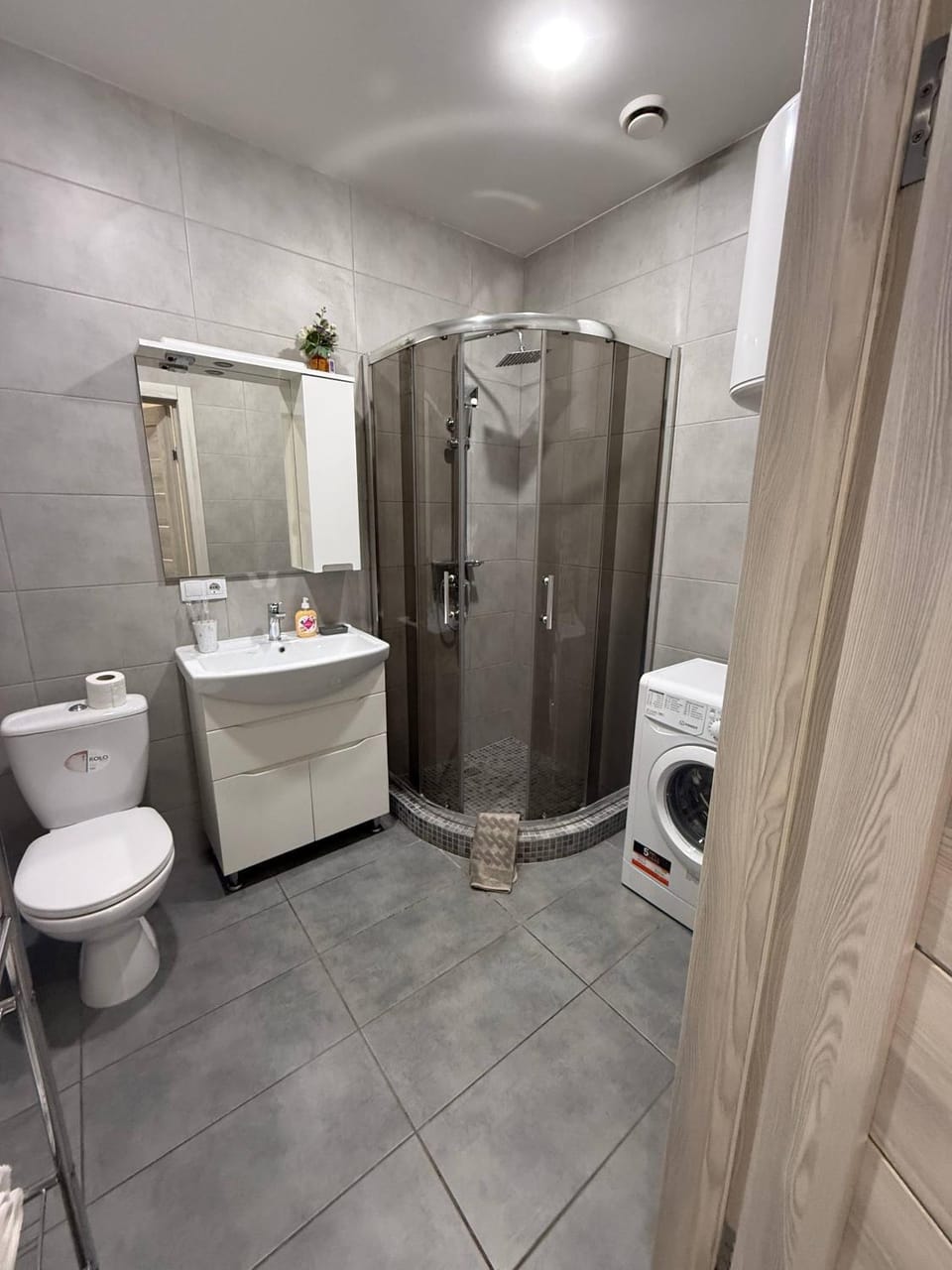 Shower, Toilet, towels, washing machine, dryer