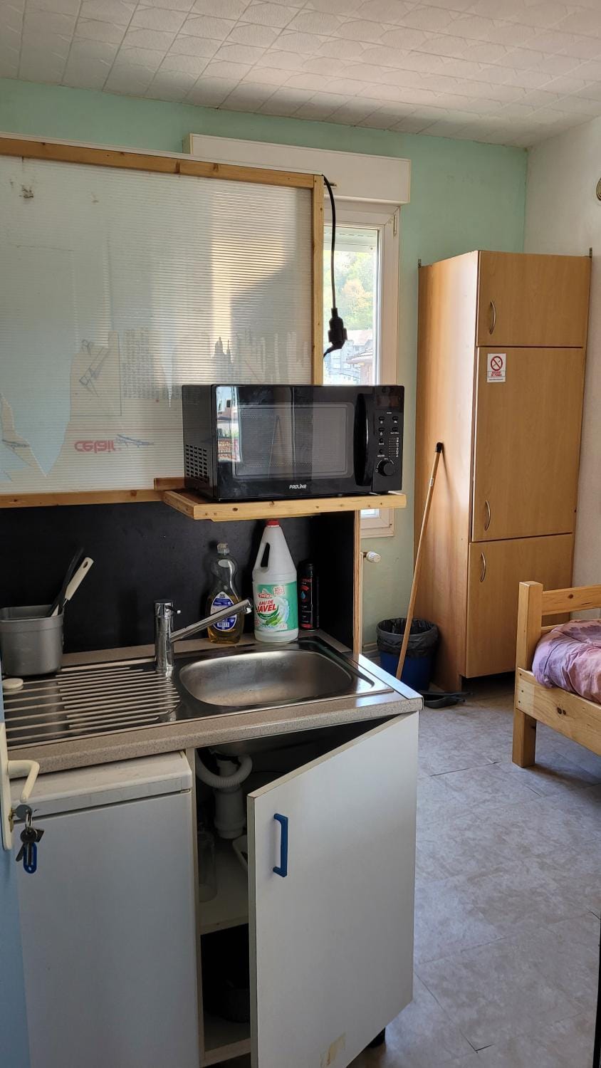Kitchen or kitchenette, stove