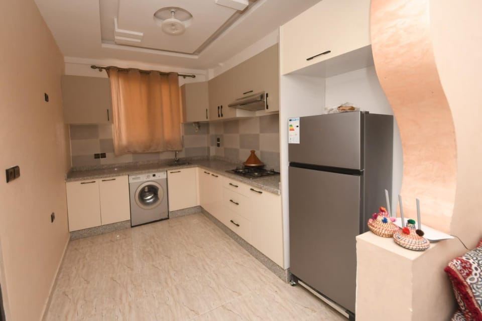 Kitchen or kitchenette, stove, washing machine
