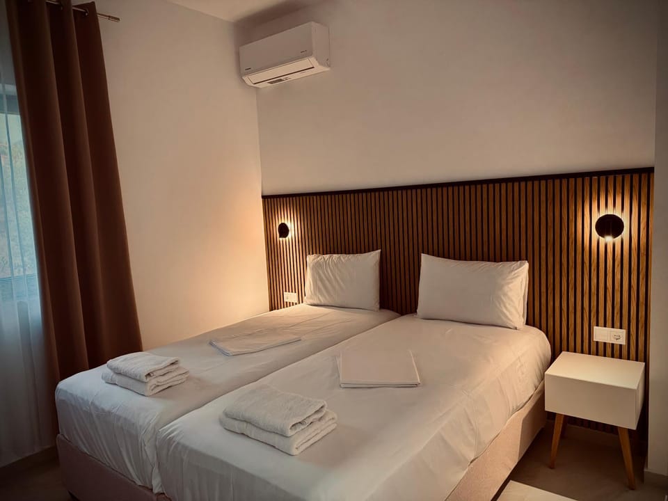 Photo of the whole room, Bedroom, towels, air conditioner