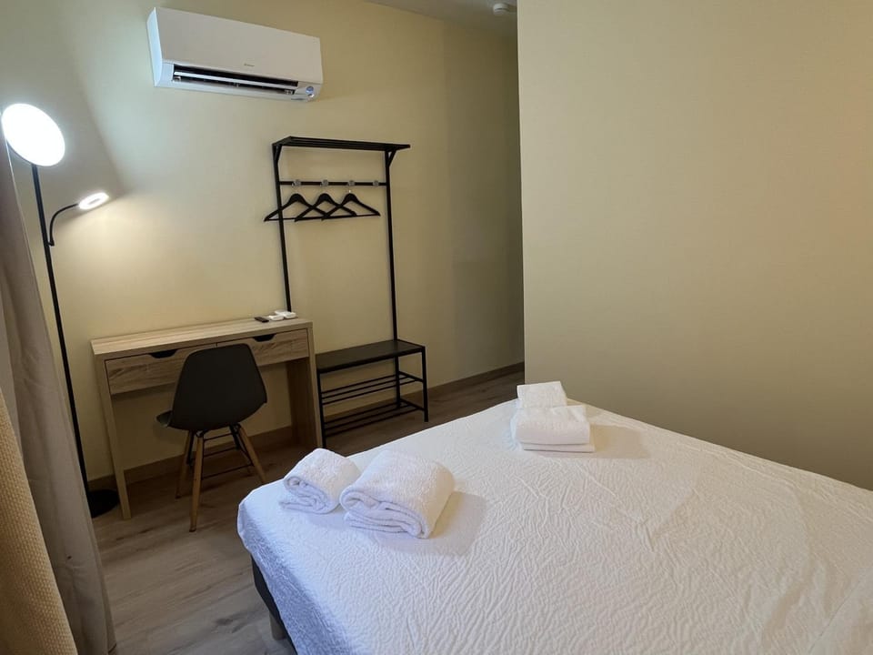 Bed, Photo of the whole room, Bedroom, towels, air conditioner