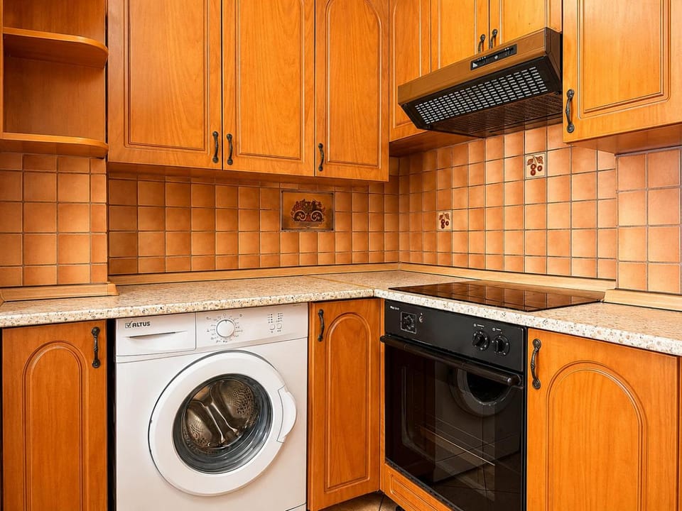 Kitchen or kitchenette, stove, washing machine