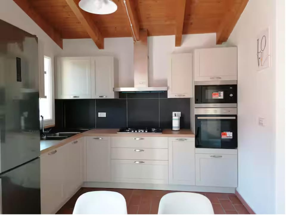 Kitchen or kitchenette, dishwasher, microwave, oven, stove