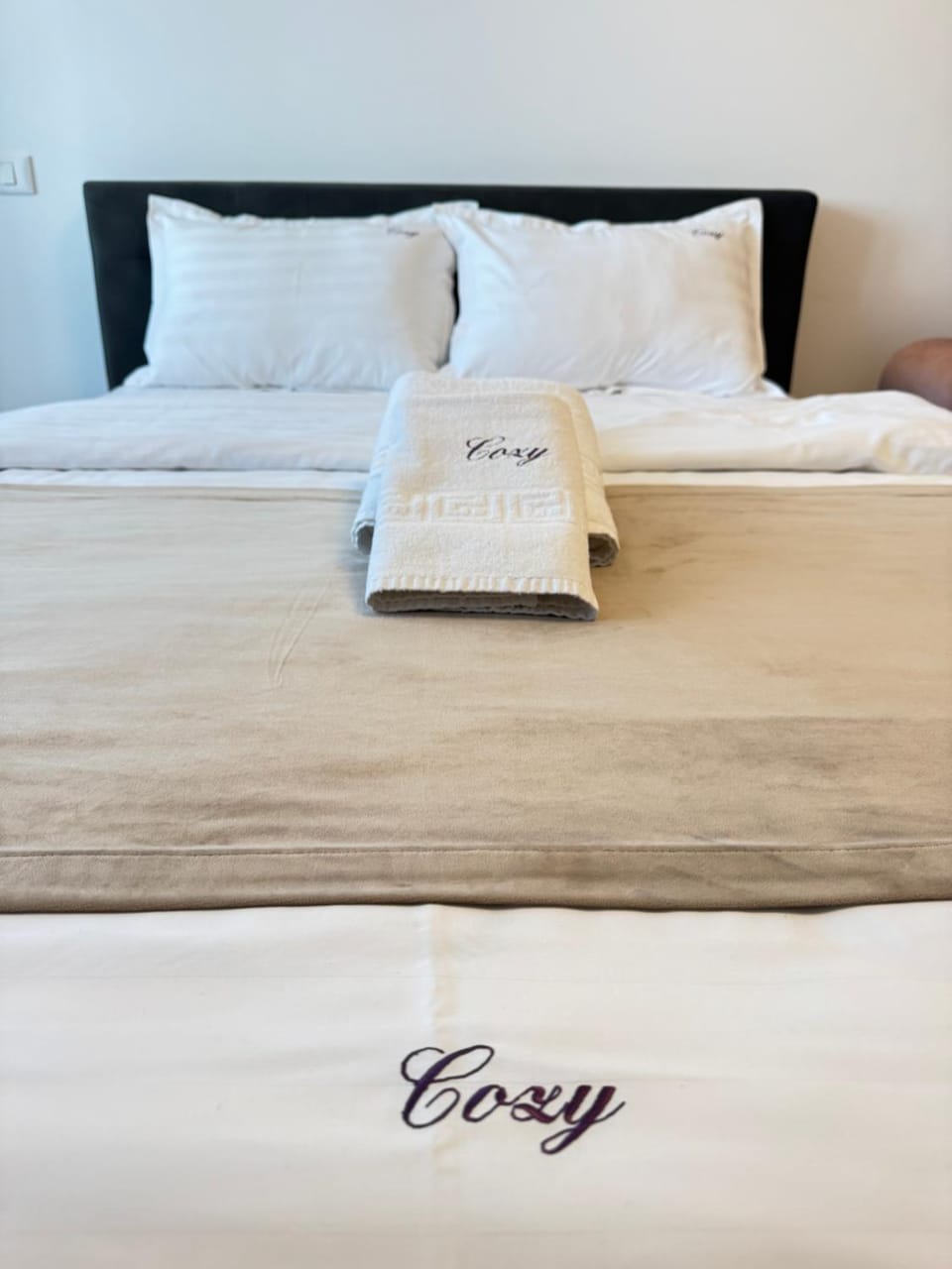 Bed, Photo of the whole room, Bedroom, Text overlay, towels