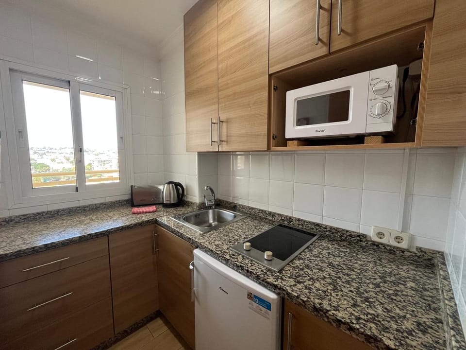 Kitchen or kitchenette, stove, toaster