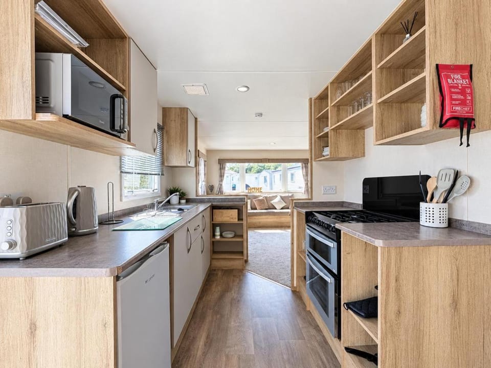 Homely caravan with side decking at Pakefield Holiday Park, Suffolk ref 68071CR House in Lowestoft