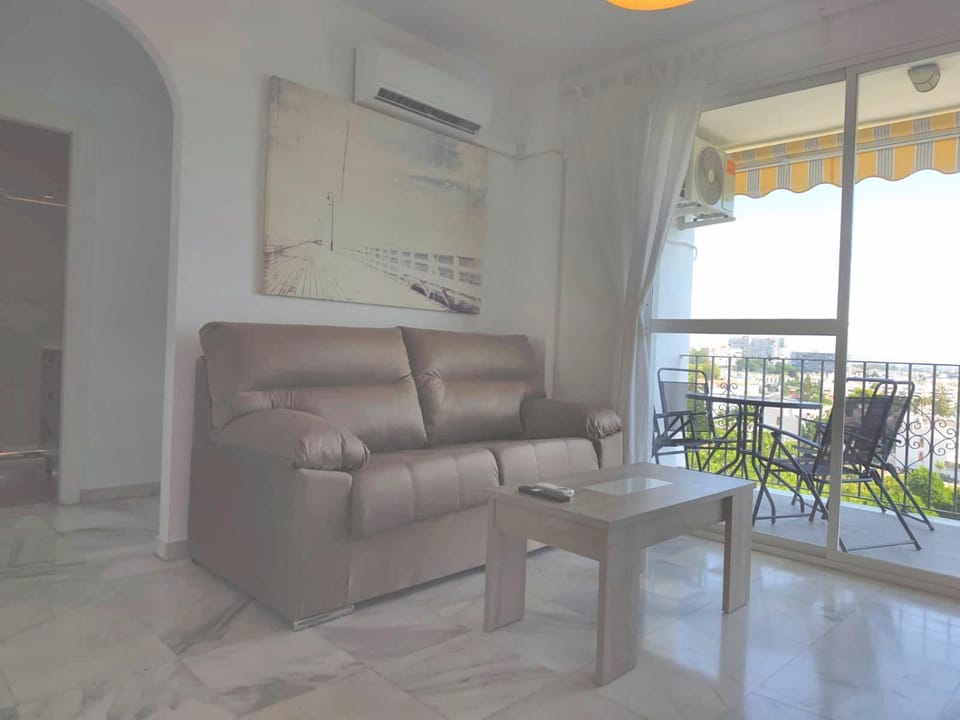 View (from property/room), Balcony/Terrace, Living room, Seating area, air conditioner